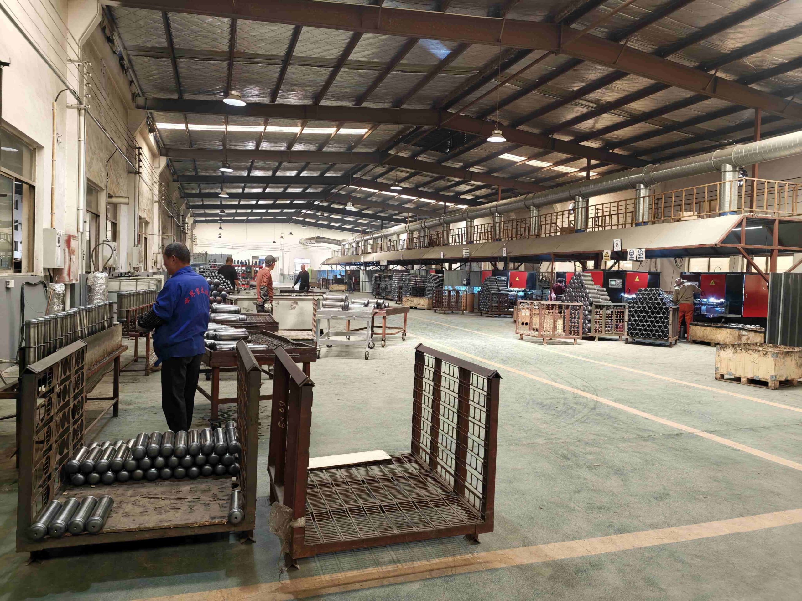 JSVS steel cylinder production workshop showing forming and welding equipment